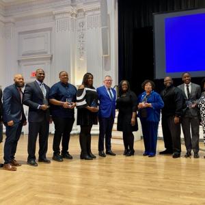 Ceremony Attendees smile for camera in ballroom
