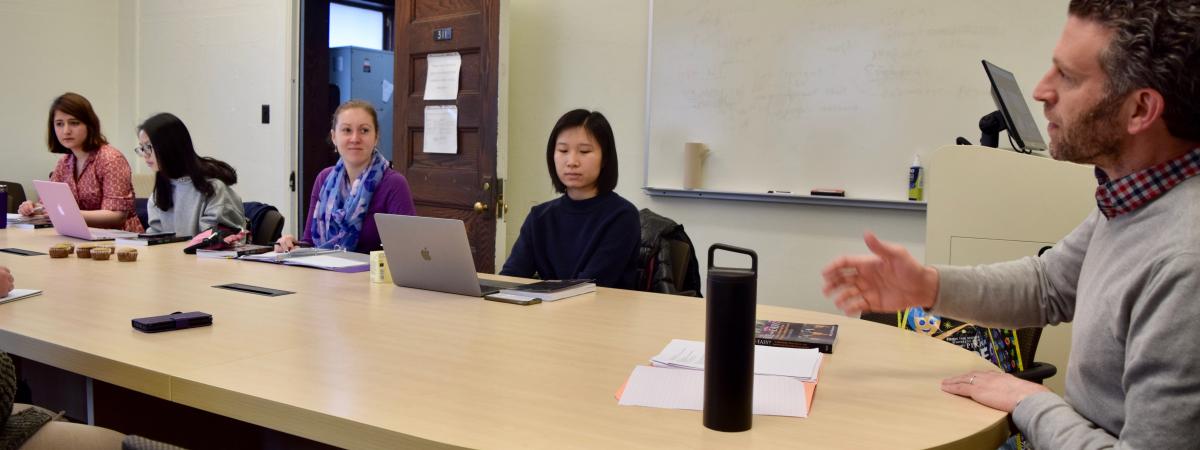 Prof Daniel Goldmark meeting with students in class