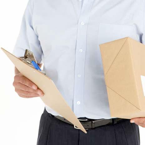 someone holding a box and envelope