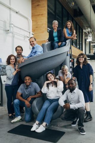 Members of Veale sitting on and around a slide.