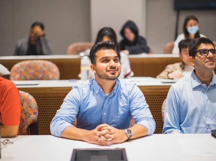 Students paying attention in a lecture hall.