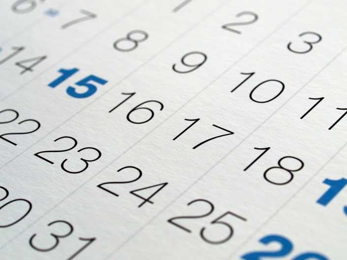 Stock image of a calendar with certain dates in bold