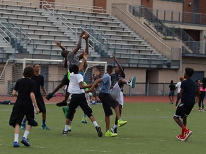 Group of teens playing football