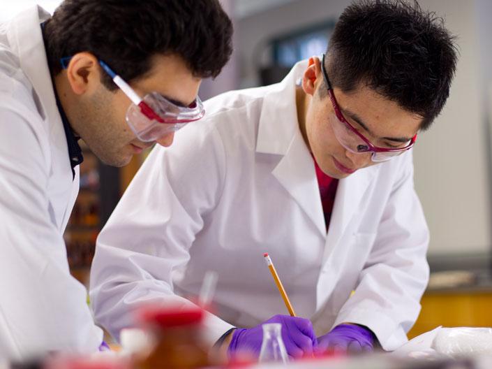 Two male Case Western Reserve University researchers working on a crystallization project