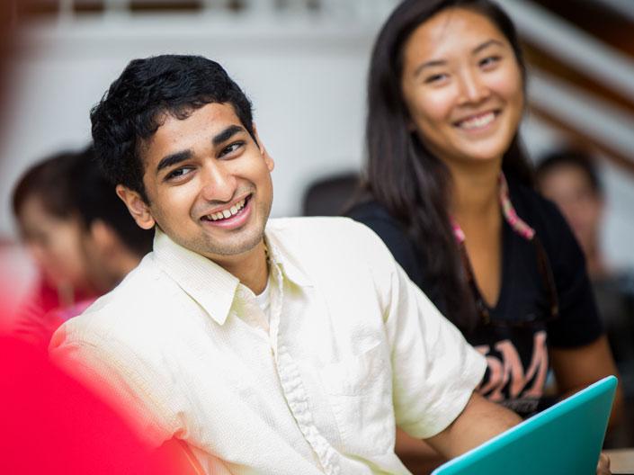 Male and female Case Western Reserve University students smiling