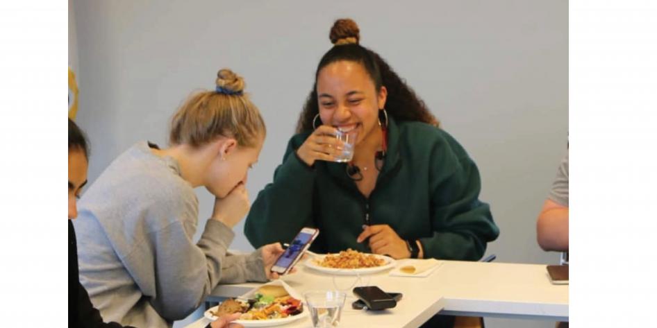 Members Halle and Andrea share an inside joke during a GELS meeting