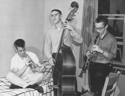 3 students playing instruments