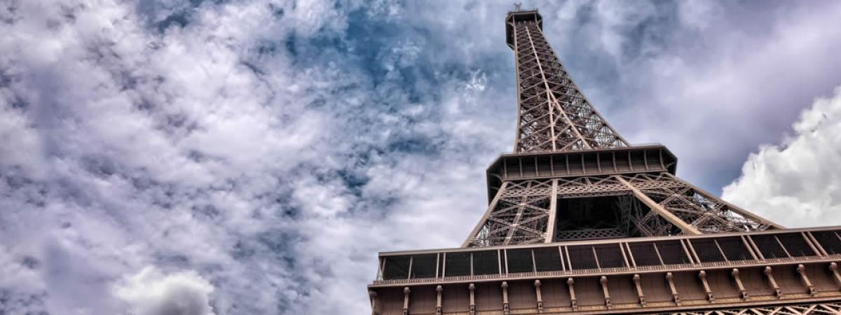 the Eiffel Tower as seen from the ground looking up