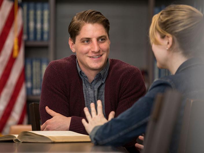 CWRU JD Law students talking in the library