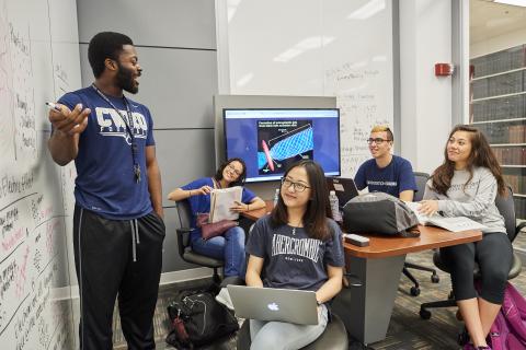 CWRU Students studying in a collaboration room.