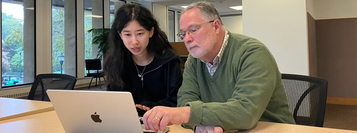 T32 Mentor, Dr. Spilsbury, view a computer screen together