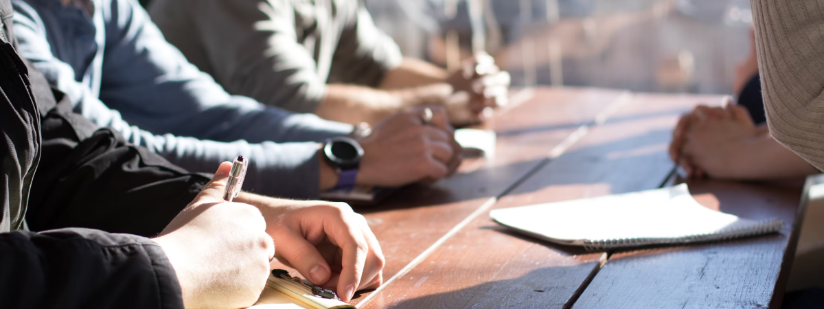 New employees sitting at a conference table during a training session