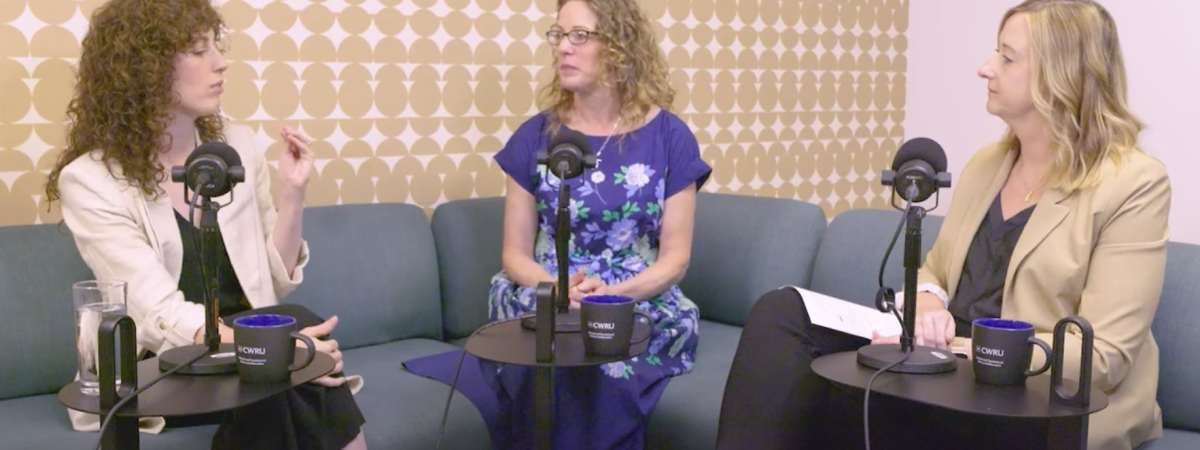 three people talking during podcast