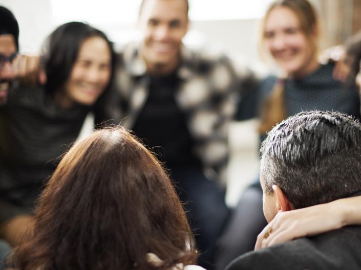 Group of multi-ethnic people in a team huddle