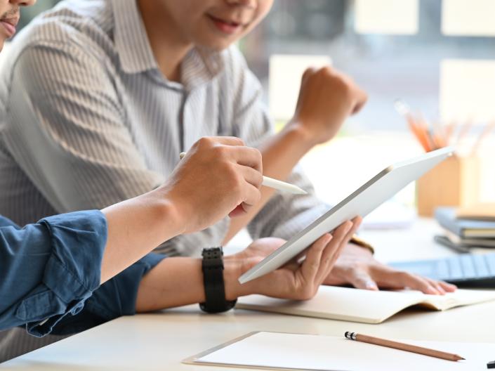 two people working on a computer
