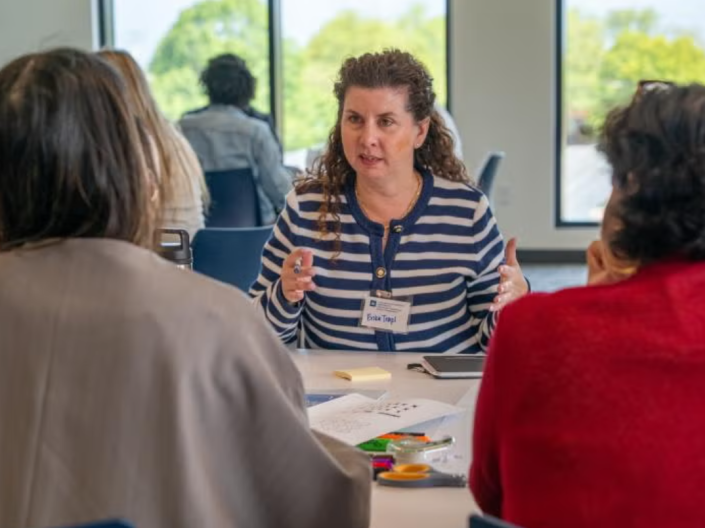 Woman talking to women