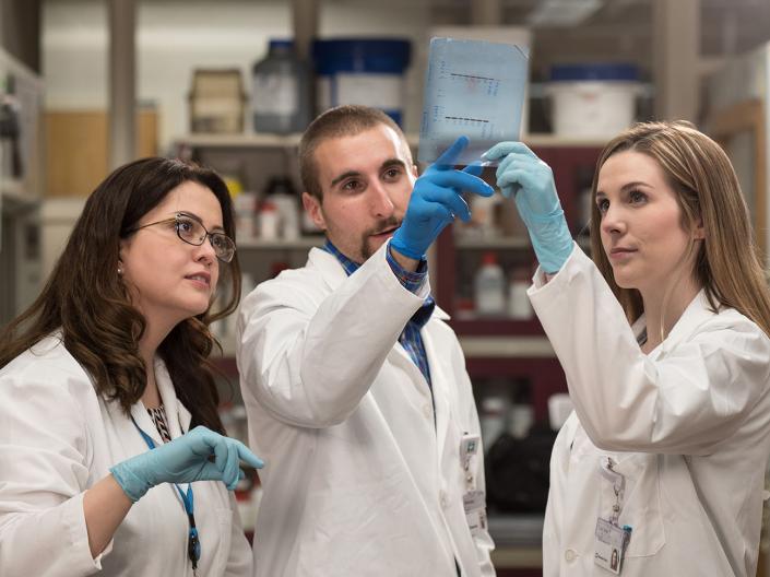 CWRU undergraduate medical students researching in a lab