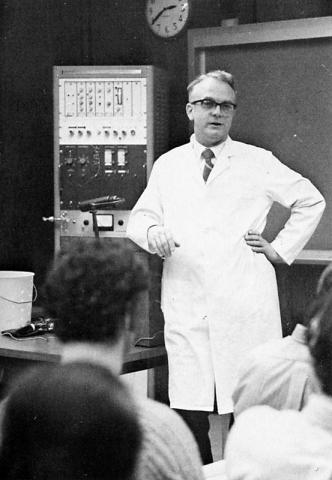 Male anesthesiologist lecturing anesthesiologist assistant students in classroom