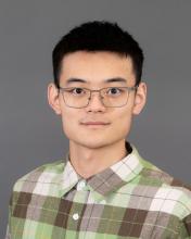 Man with glasses and dark hair