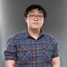 Man with glasses and dark hair