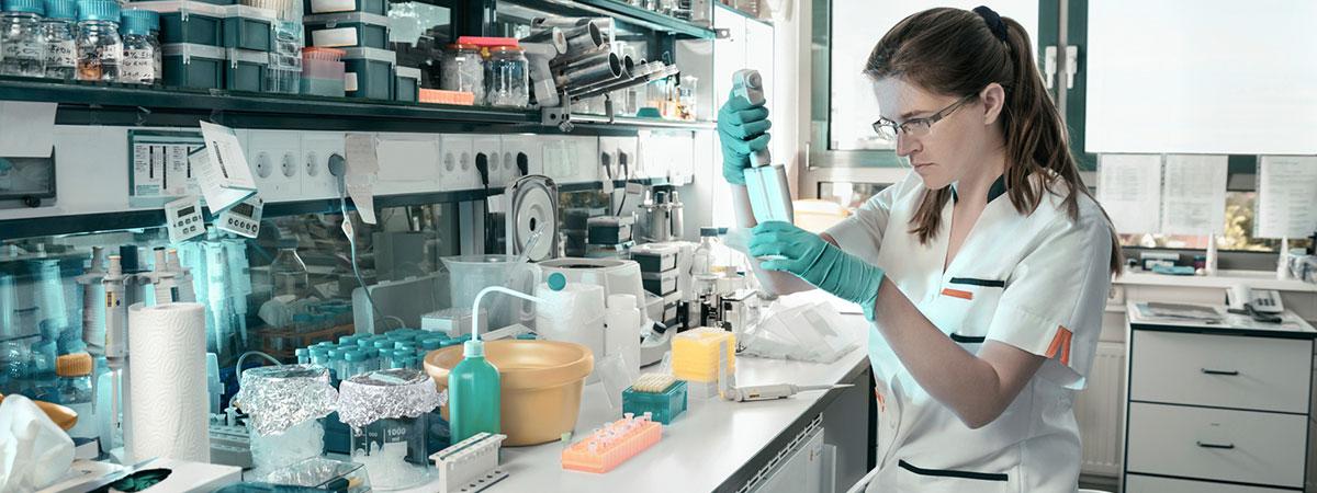 Student working in a modern chemistry/biology lab