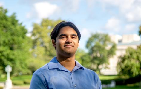 A photo of Anish Singh sitting on a bench by Wade Lagoon