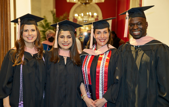 Four students at commencement 05.2022