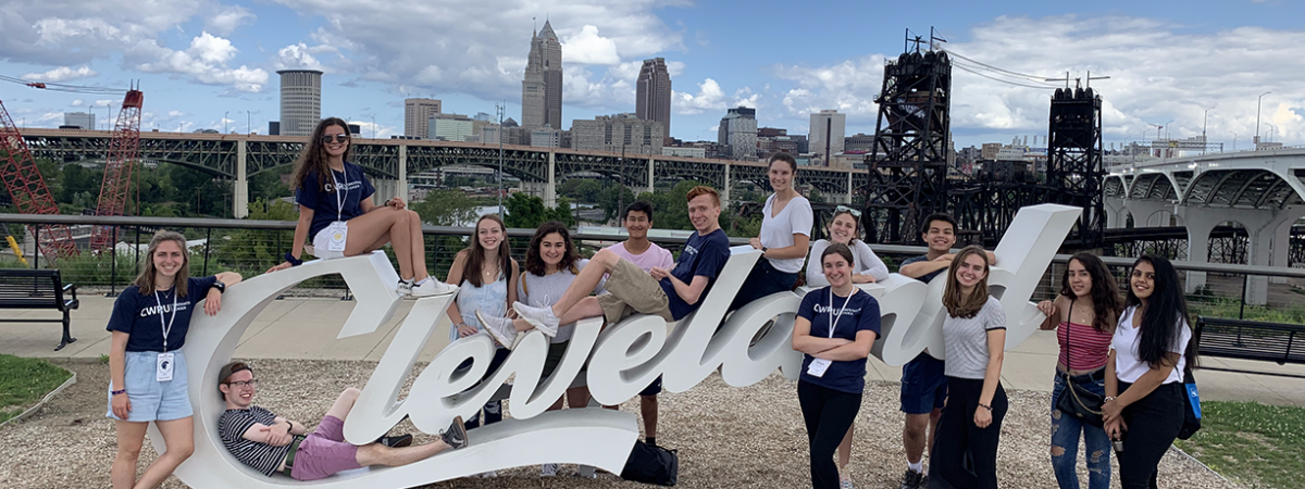 students posing around a Cleveland sign during the Discover Cleveland event
