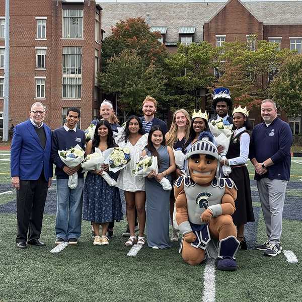 CWRU’s homecoming court, along with mascot Spartie, President Eric W. Kaler and Vice President for Student Affairs Travis Apgar.