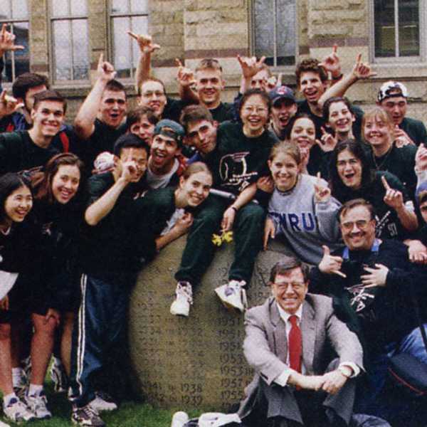 First year students huddled around on the rock outside Adelbert Hall after winning the 1997 Hudson Relays.
