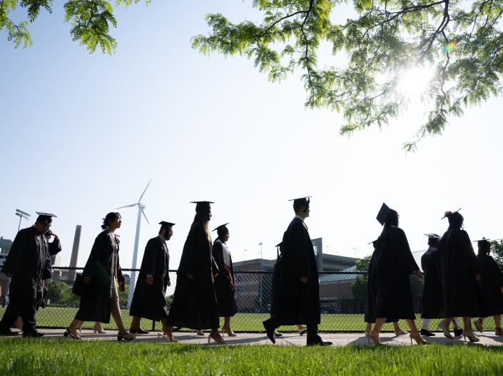 Students process into commencement