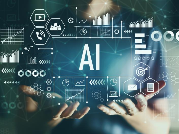 Person's hands holding the word AI