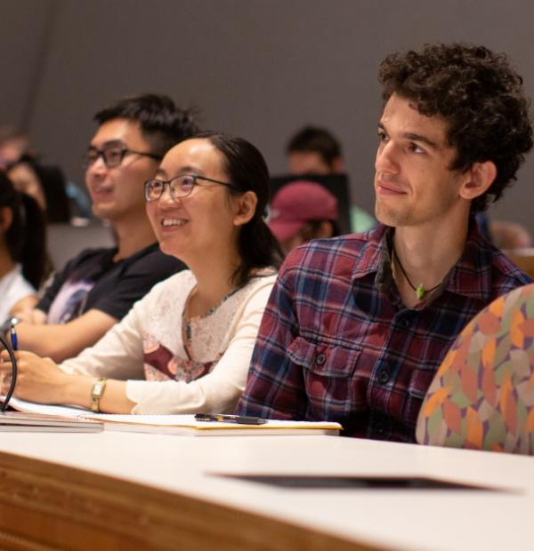 Students in a classroom smiling