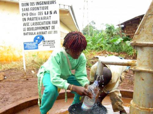 Children gather clean water from one of two water supplies built by Engineers Without Borders-Case Western Reserve University in Batoula, Cameroon, during the summer of 2010.