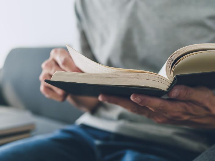 Hands holding book
