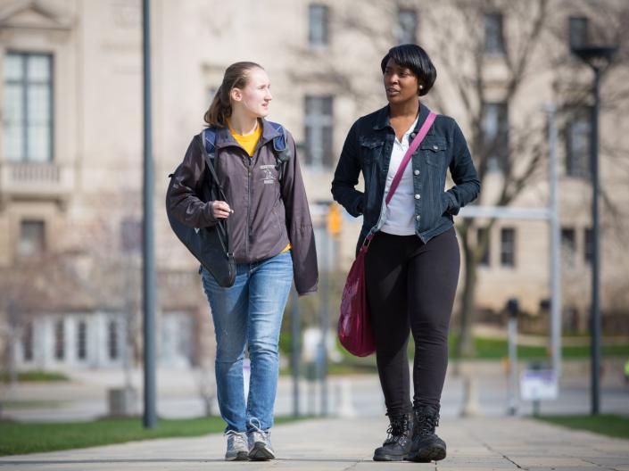 Two individuals walking on the CWRU binary walkway