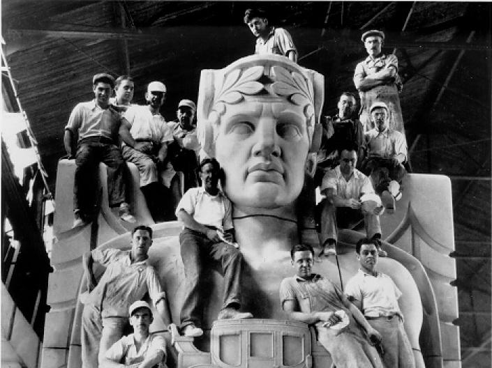 Stone carvers pose in their workshop on a sculptural pylon for the Lorain-Carnegie Bridge, later renamed the Hope Memorial Bridge, ca. 1931. WRHS.