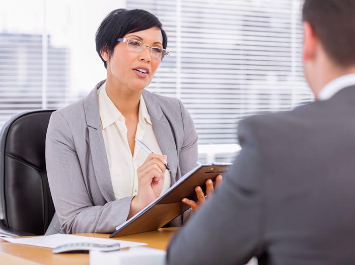A female supervisor talking to an employee