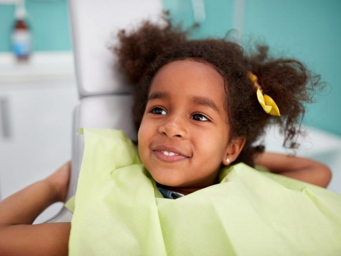 Child smiling after dental checkup.