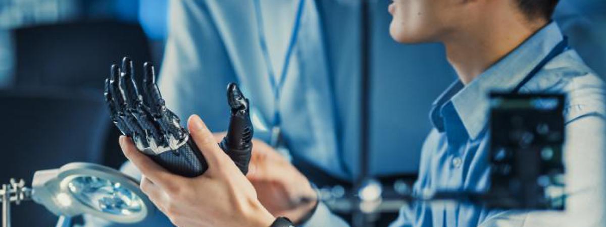 Engineer workign on a robotic prosthetic hand