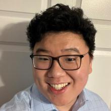 A headshot of Xufei Wang