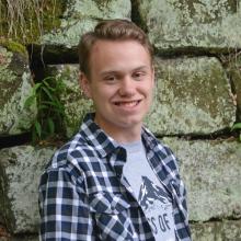 A headshot of Austin Wilson