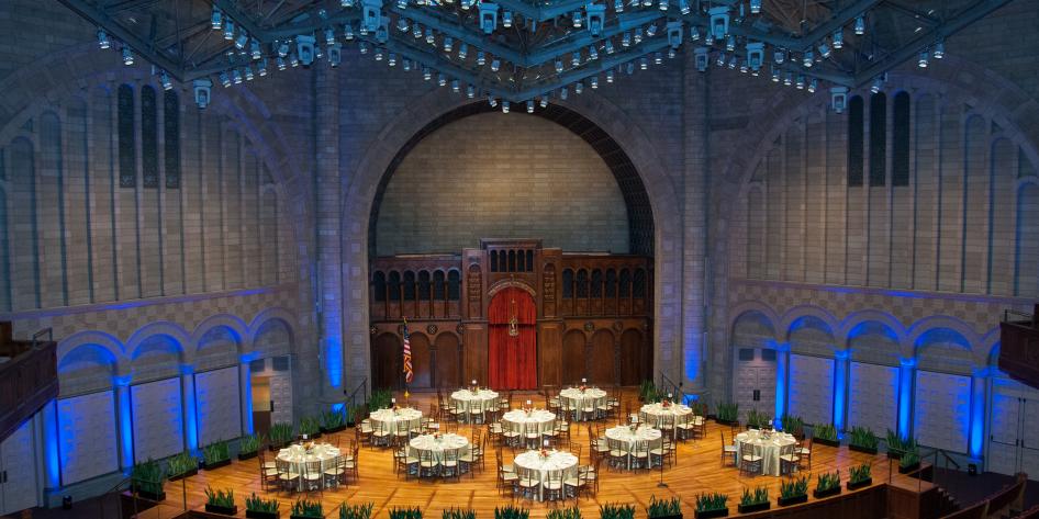 Catered dinner set up on stage at Silver Hall