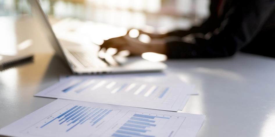 Person working at a computer keyboard