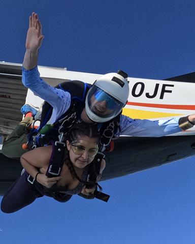 Tommy Gautier and friend skydiving out of an airplane