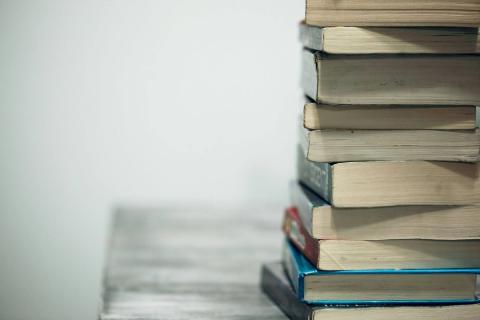 A stack of books sitting on a table