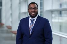 smiling man in blue suit