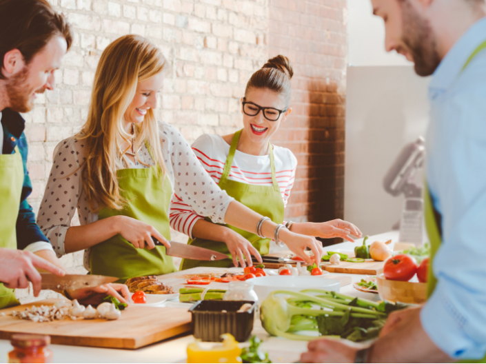 Men and women at a cooking class