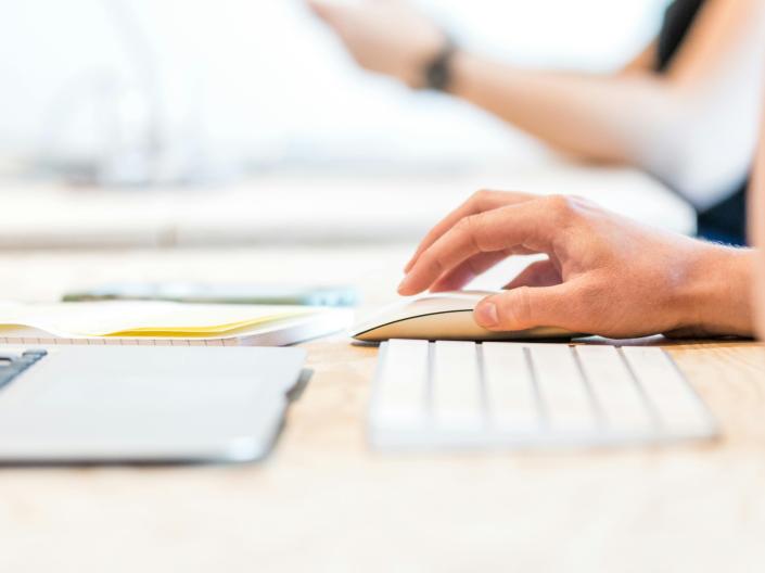 A person using a mouse and keyboard.