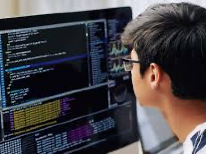 Student working at a computer screen